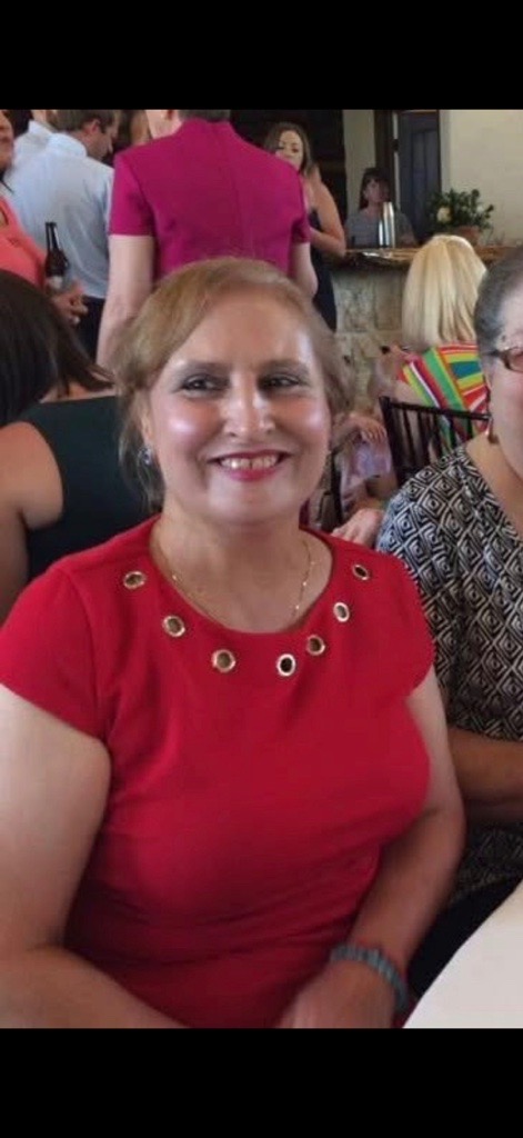Denise, Jeneen's newly found older sister, in a red dress at an event
