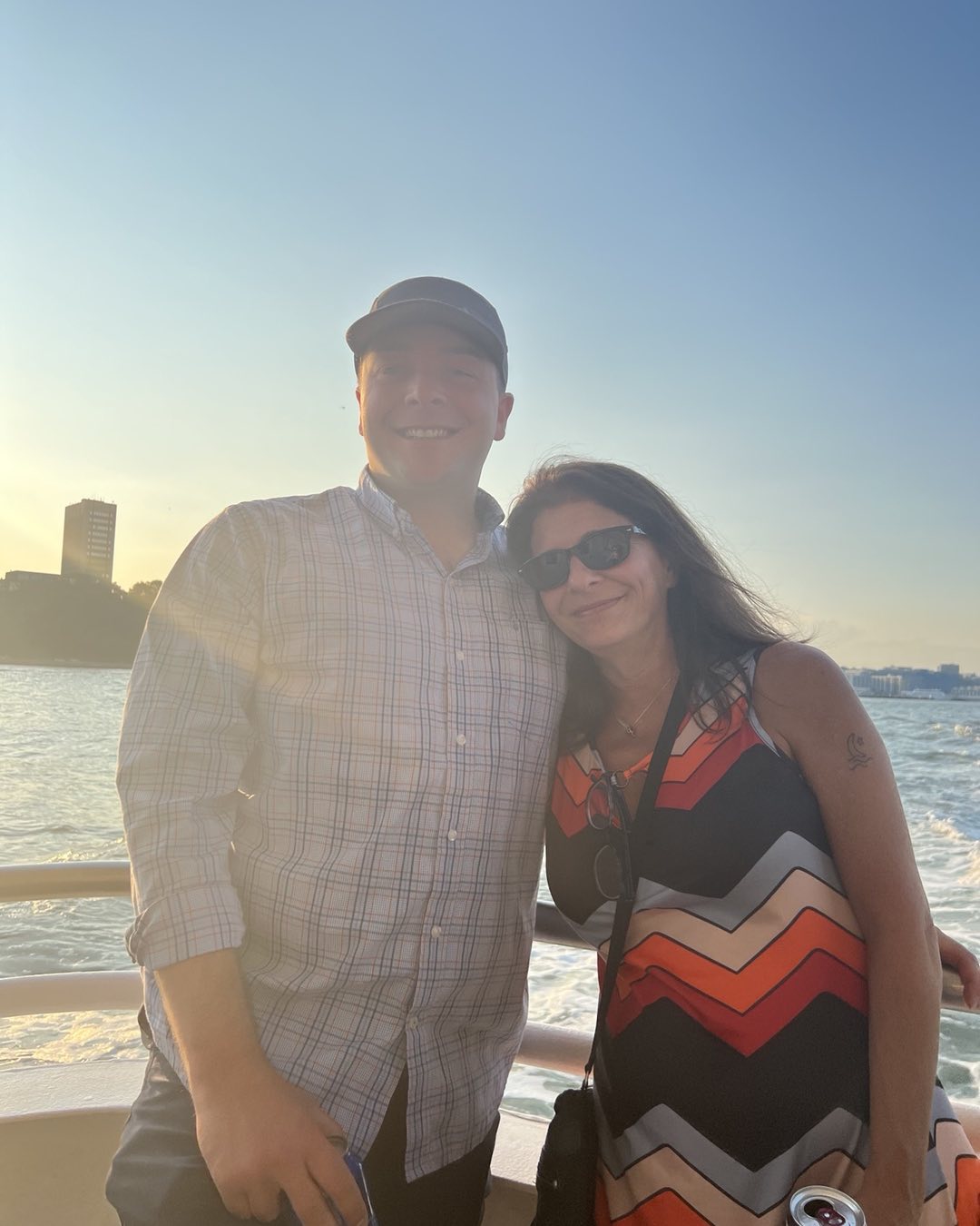 Me and mum on a boat at sunset