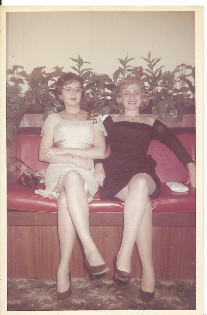 Jeneen's mother (left, in white lace) on a red banquette with a friend, dressed for a night out
