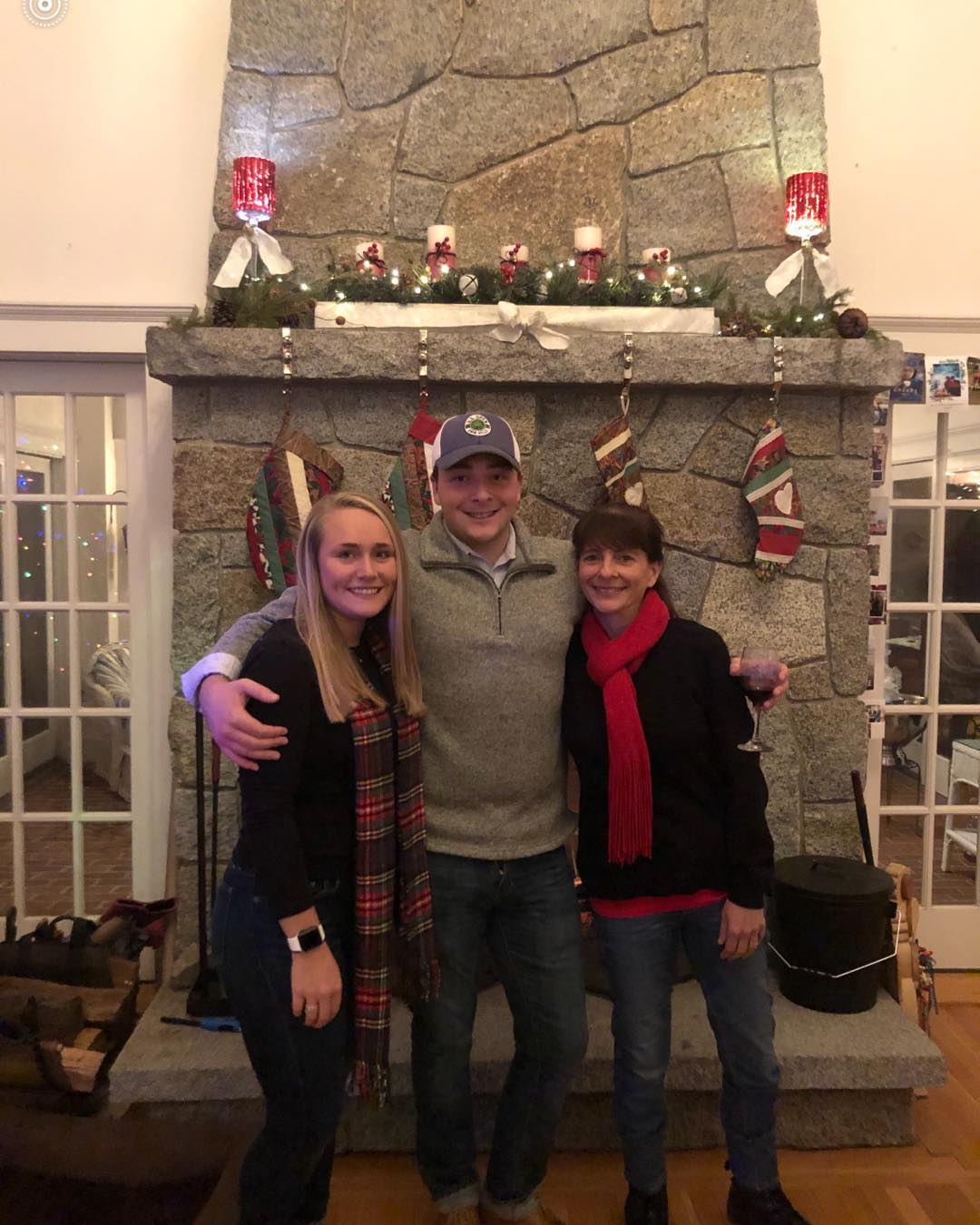 Me, Caryn, and mum at the fireplace at Christmas